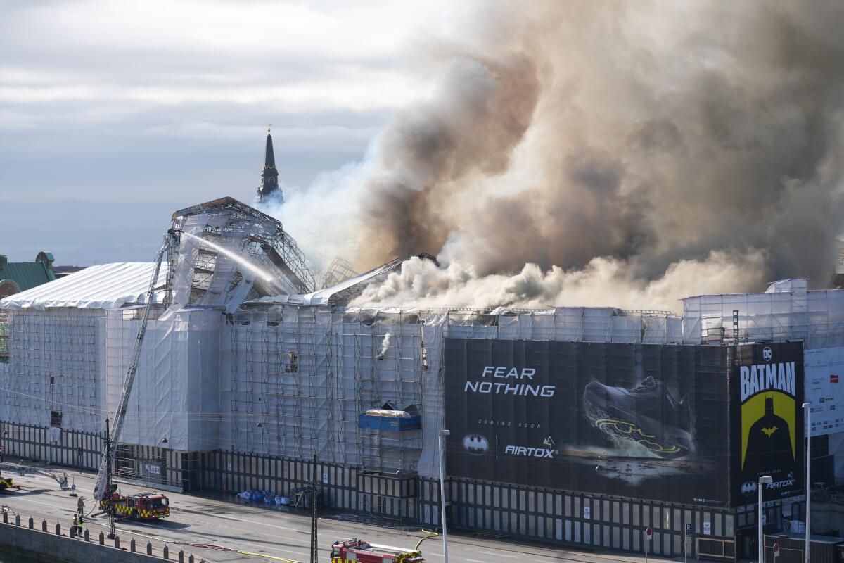 Fire destroys Copenhagen’s Old Stock Exchange dating to 1600s, collapsing its dragon-tail spire