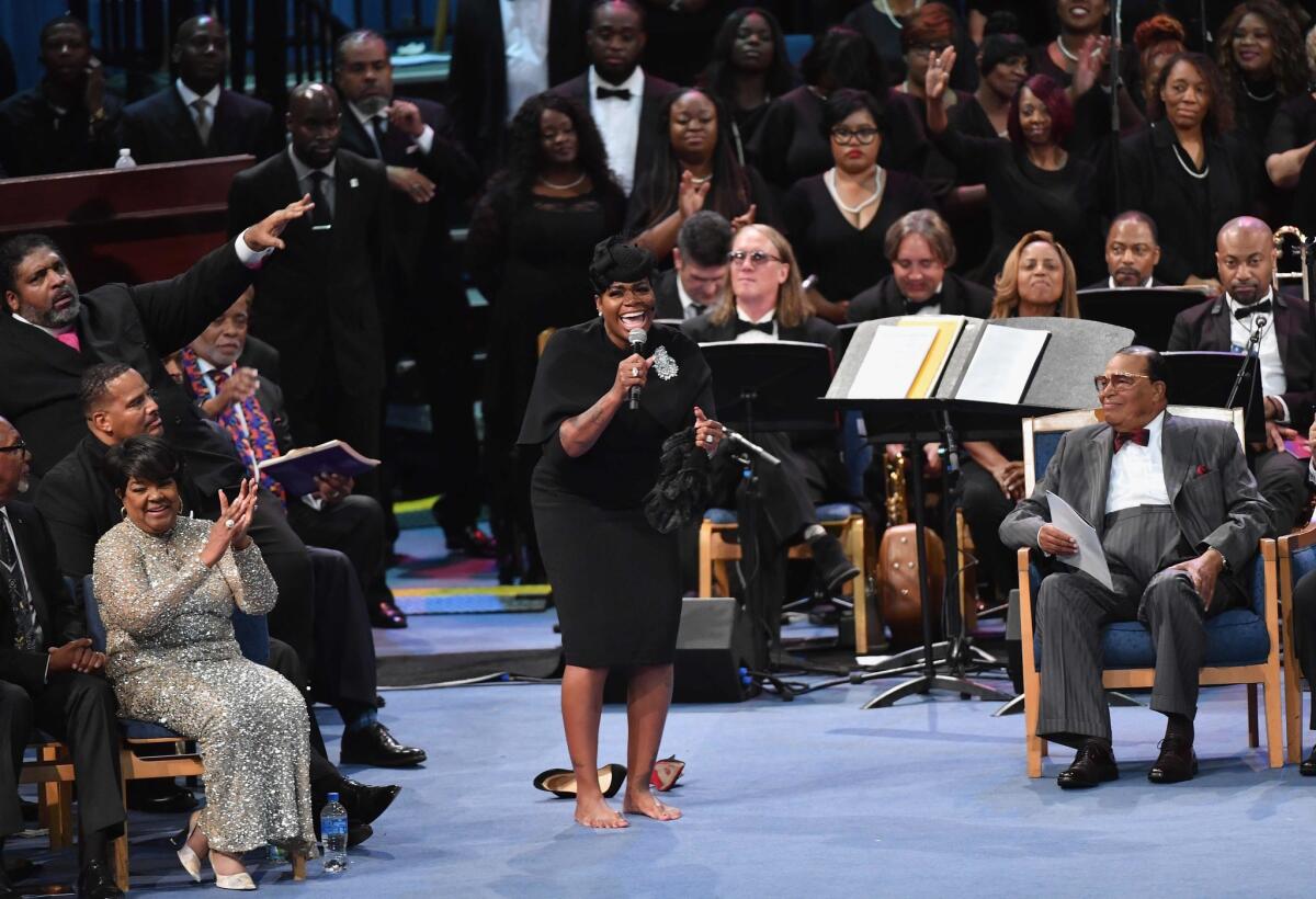 Fantasia Barrino-Taylor performs at Aretha Franklin's funeral at Greater Grace Temple in Detroit on Friday.