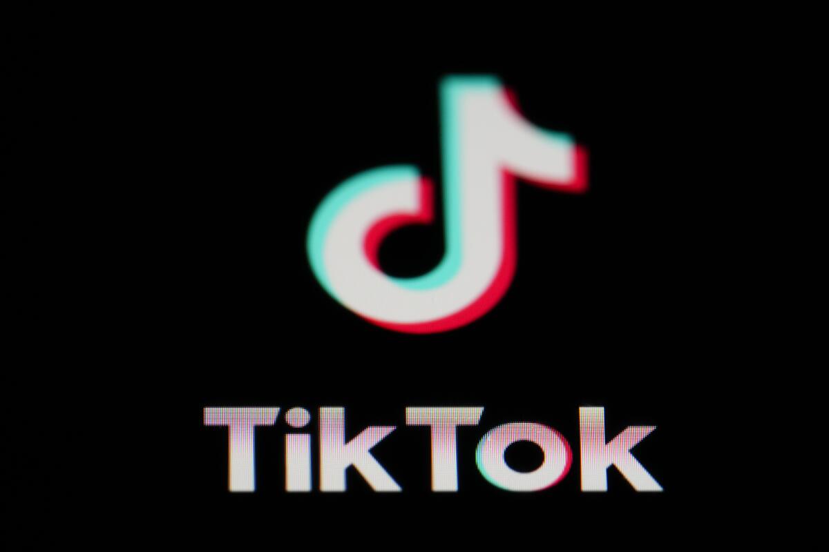 The icon for the video sharing TikTok app is seen on a smartphone.