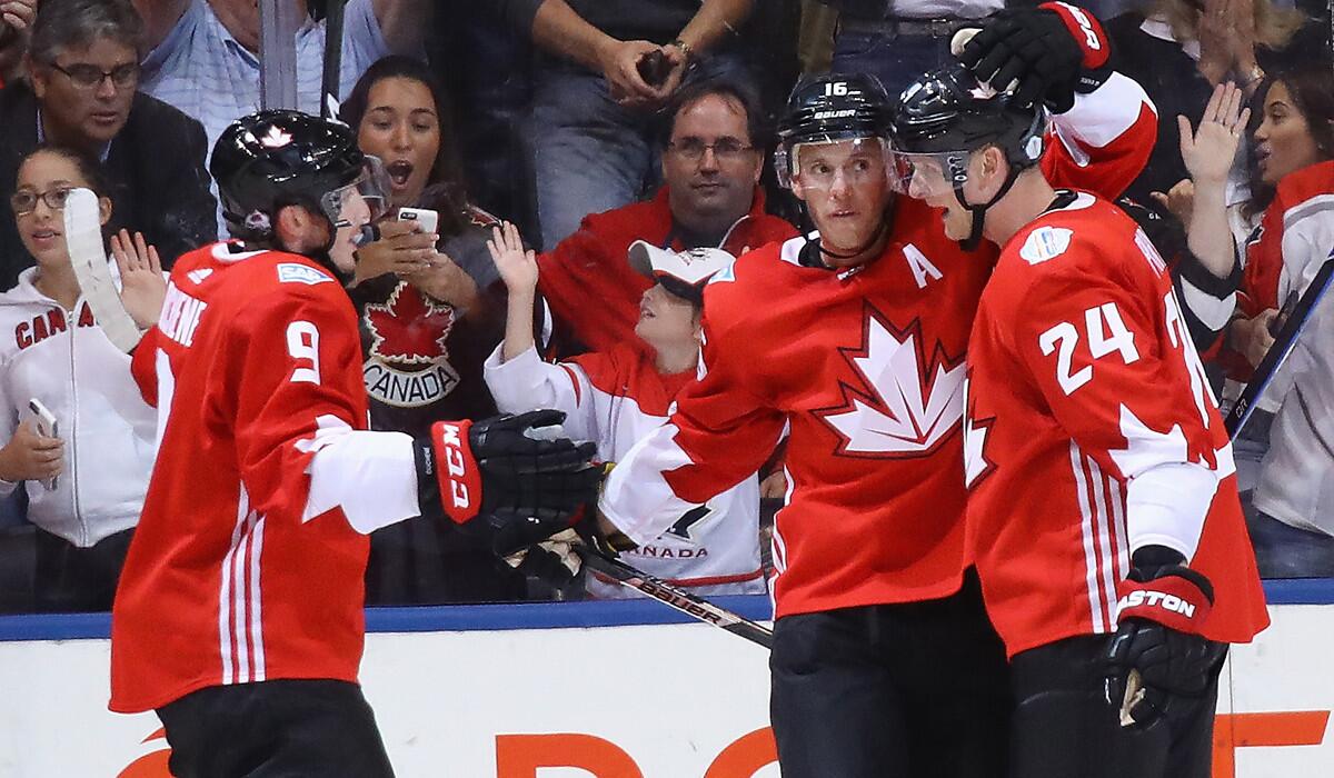 Team Canada's Matt Duchene (9), Jonathan Toews (16) and Corey Perry (24) celebrate Toews' goal during the first period against Team Europe during the World Cup of Hockey on Sept. 21.