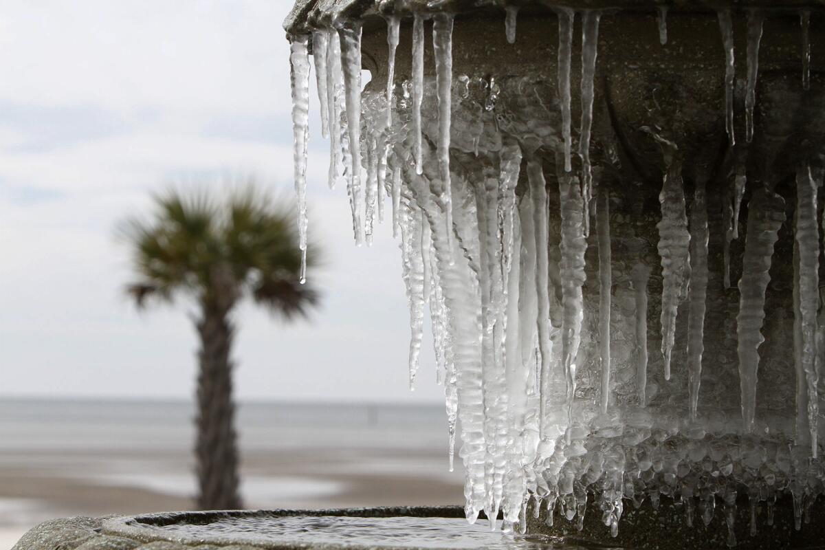 Icicles hang from a fountain at Beau View condominiums in Biloxi, Miss.
