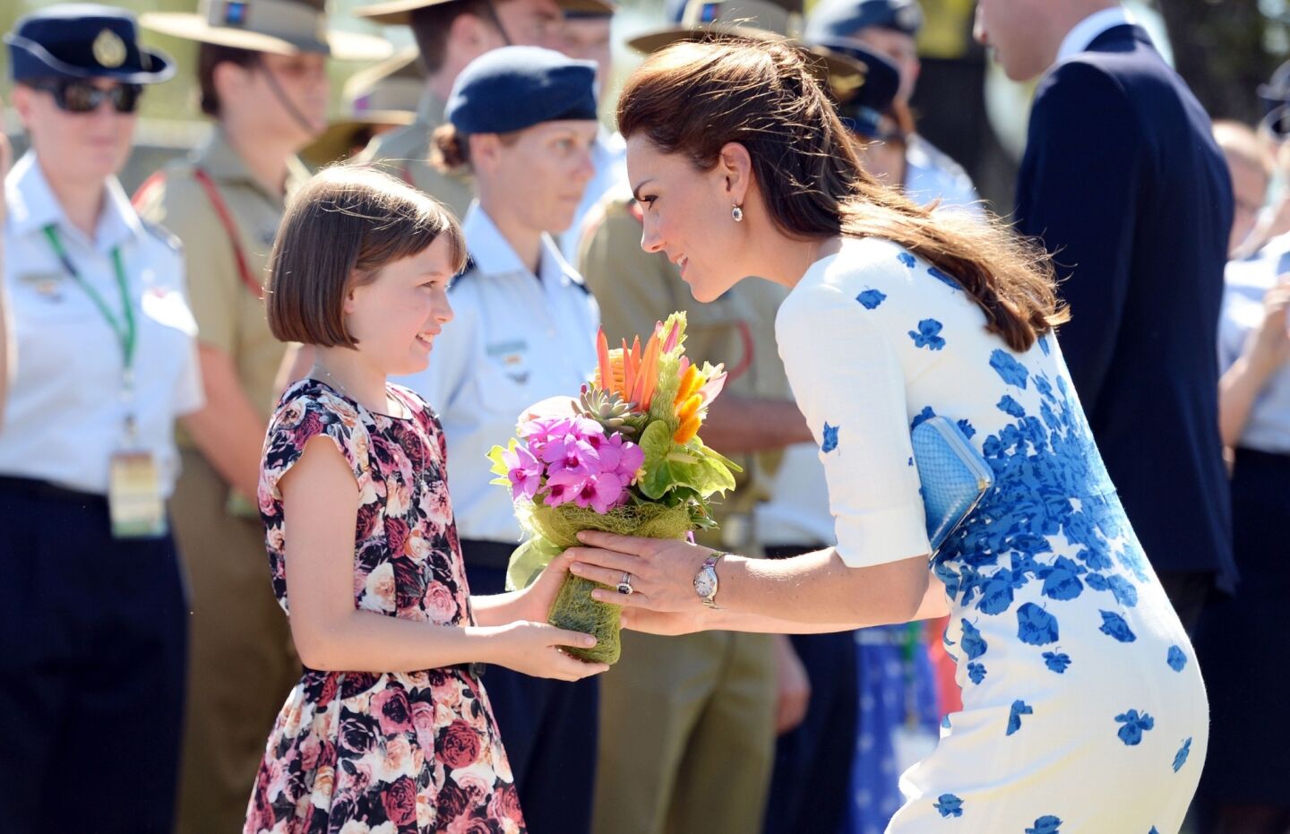 Catherine, duchess of Cambridge receives flowers from 9 year-old Ashleigh Kearnan.