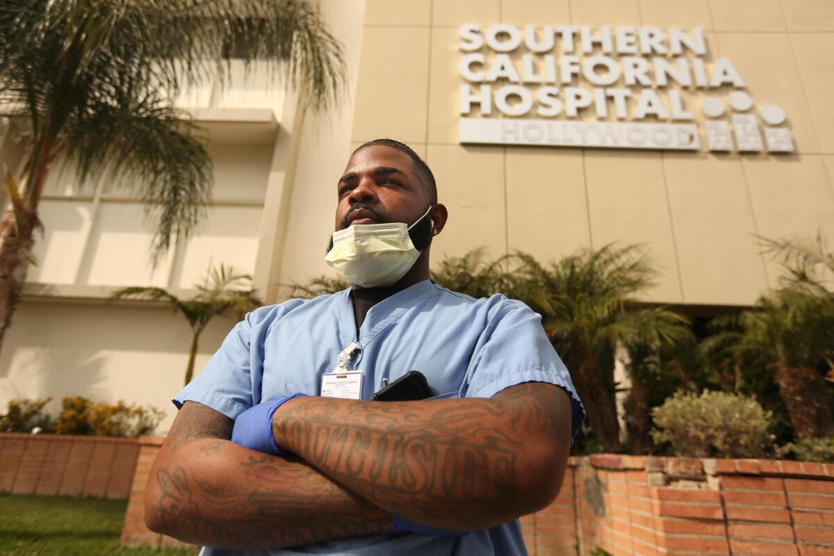 Andre Ross, 30, is a floor care specialist at Southern California Hospital in Hollywood. He disinfects the floors of patients' rooms, including possibly those of COVID-19 patients.