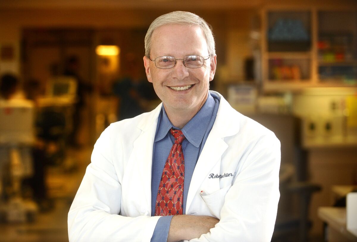 Dr. Robert Wachter wears a white coat