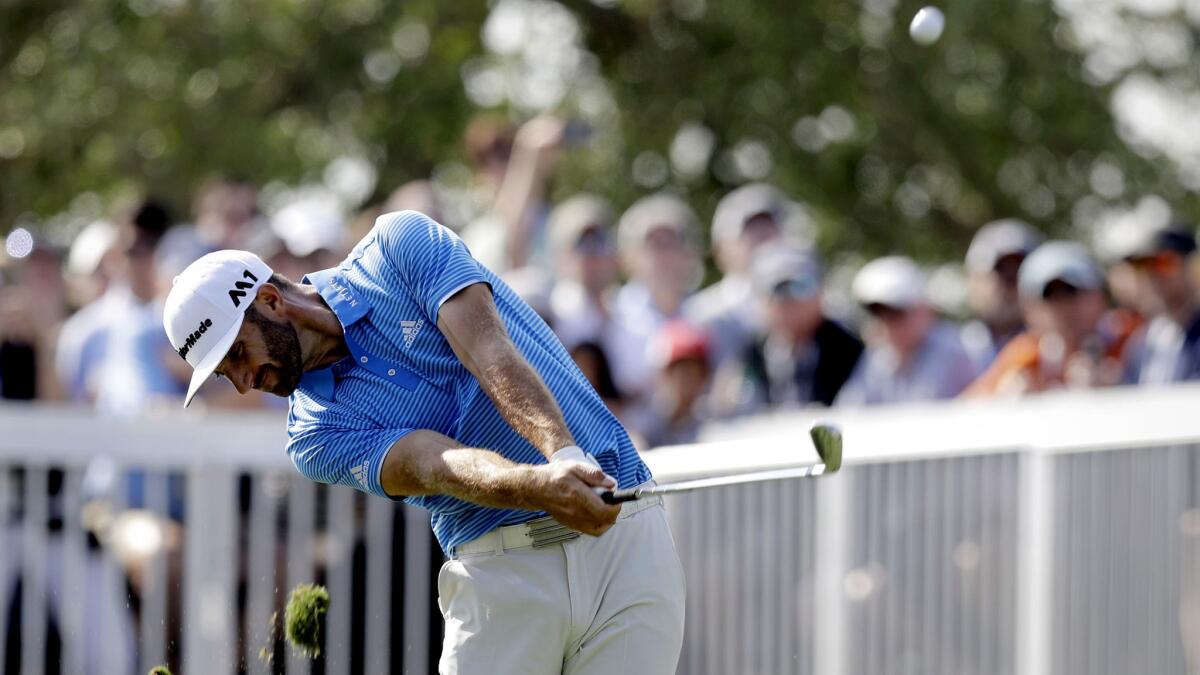 Dustin Johnson hits his tee shot on the seventh hole during the semifinals of the Dell Technologies Match Play golf tournament at Austin County Club on Sunday. (Eric Gay / Associated Press)