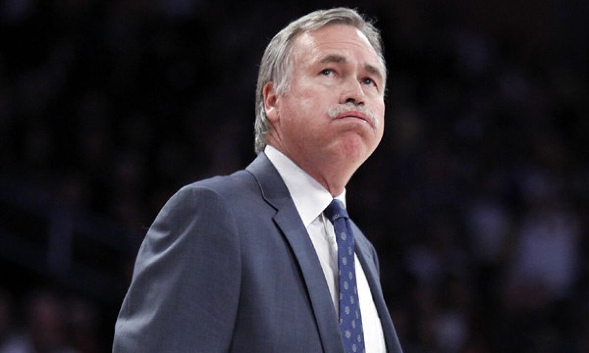 Lakers Coach Mike D'Antoni looks at the scoreboard during a loss to the Milwaukee Bucks on Dec. 31.