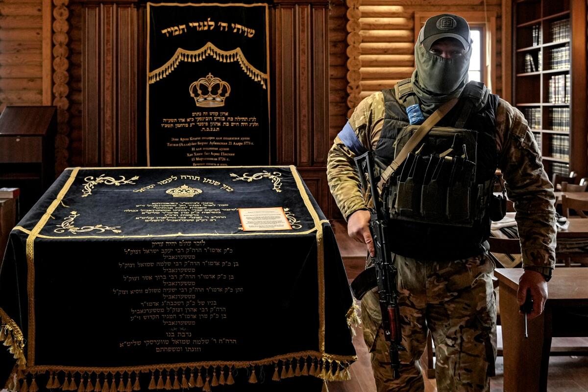 A  security team member in the synagogue at a Jewish settlement outside Kyiv, Ukraine