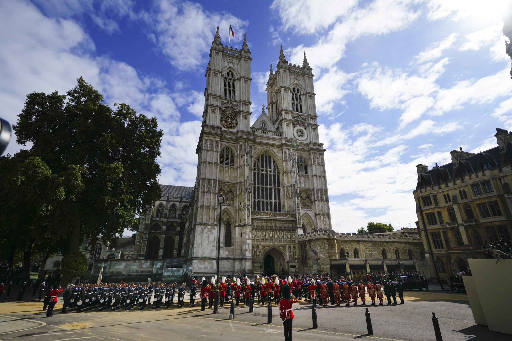 Troops and guards are amassed outside Westminster Abbey.