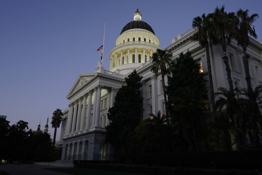 The lights of the Capitol dome shine as lawmakers work into the night in Sacramento, Calif., Friday, Sept. 10, 2021. Lawmakers have until midnight to finish work on the 2021 legislative session. (AP Photo/Rich Pedroncelli)