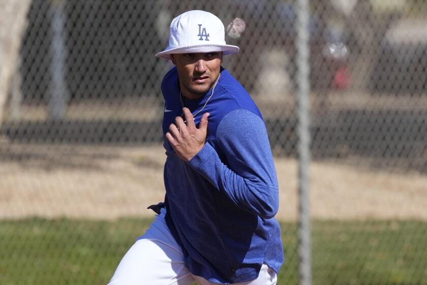 Los Angeles Dodgers' Miguel Rojas runs the bases during the first day of spring training baseball.