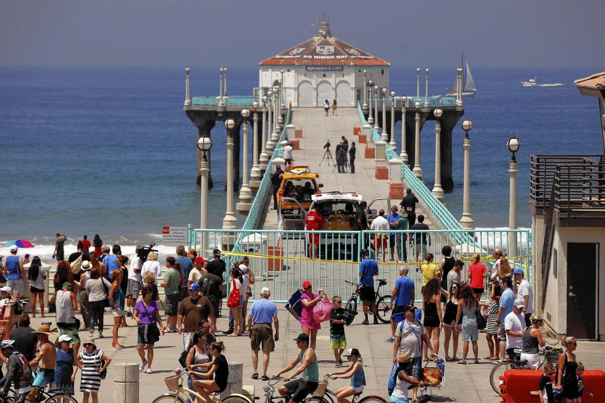 The Manhattan Beach Pier is a popular fishing spot, but after a swimmer was recently bitten by a shark, fishing there has been temporarily banned.