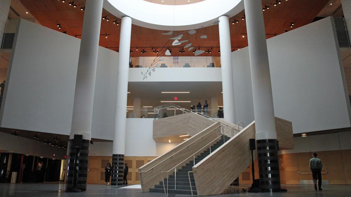 The Third Street lobby inside the old Mario Botta building replaces the Swiss architect's strong granite entry with a soft maple staircase. Unfortunately, that removed the most interesting thing about the Botta building: its powerful staircase entrance.