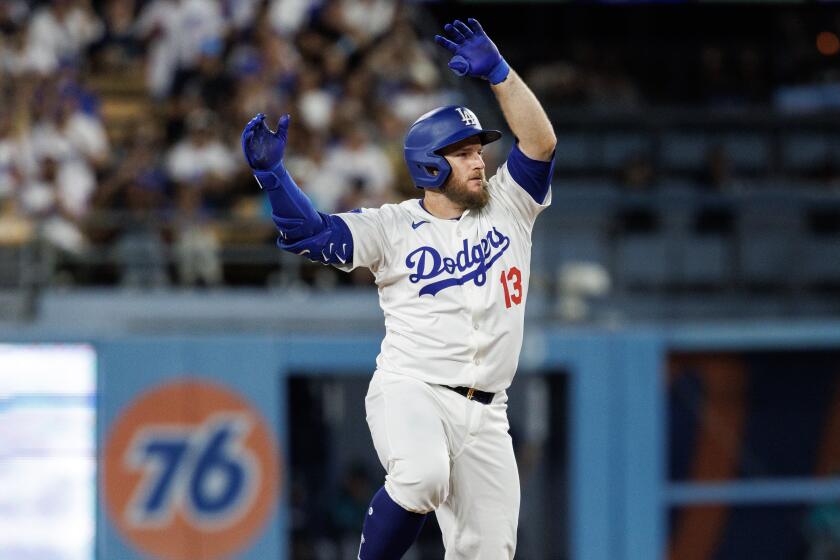 LOS ANGELS, CA - AUGUST 21, 2024: Los Angeles Dodgers third base Max Muncy (13) reacts.