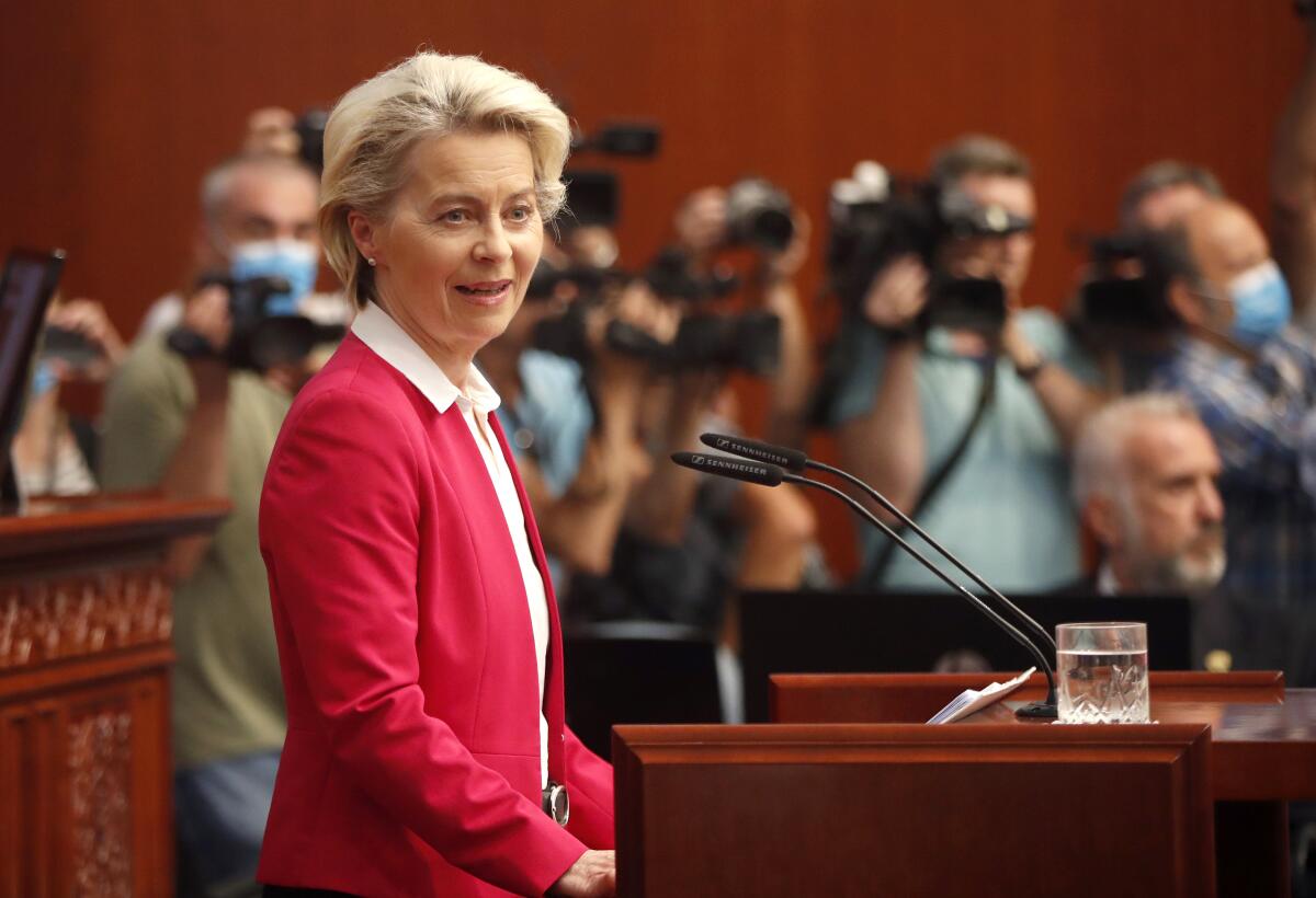 European Commission President Ursula von der Leyen gives a speech to the lawmakers in the Parliament building in Skopje, North Macedonia, on Thursday, July 14, 2022. The European Union's leader pledged on Thursday North Macedonia's lawmakers to back the French proposal on solving bilateral disputes with Bulgaria as condition for the tiny Balkan country to open membership talks with the block, while thousands of people are protesting the deal in front of the parliament building. (AP Photo/Boris Grdanoski)