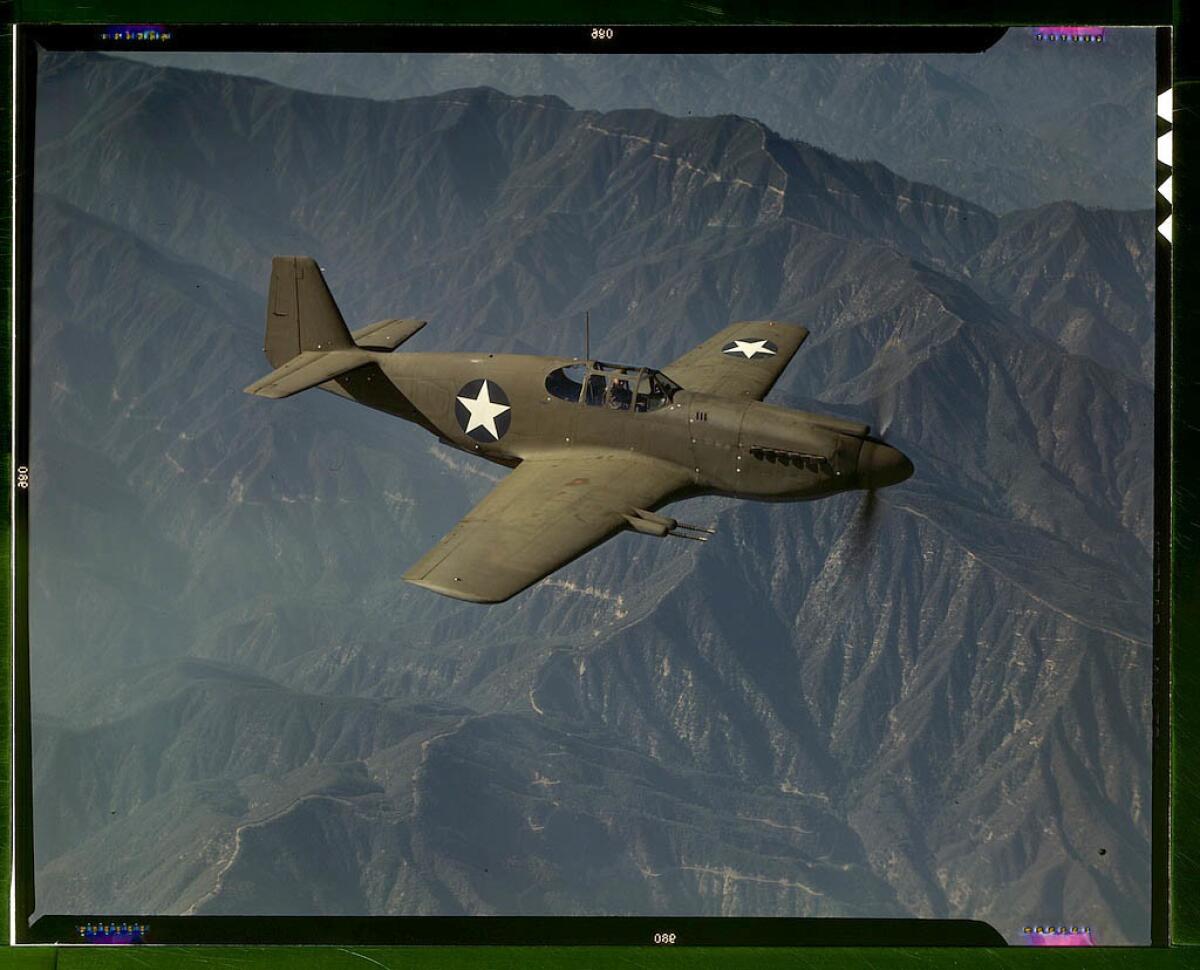 P-51 "Mustang" fighter in flight over Southern California. Built by North American Aviation in Inglewood. October 1942. Early version of the aircraft.