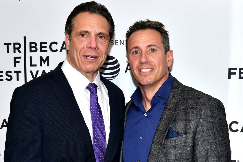  Andrew Cuomo and Chris Cuomo stand side by side