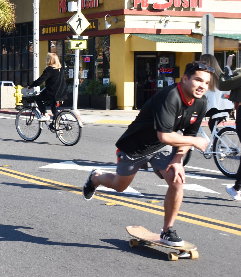 Skateboarders and bicyclists shared the street during CicloSDias.