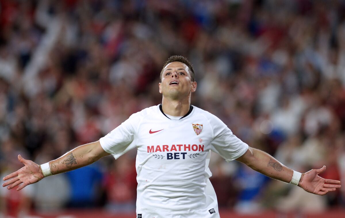 Sevilla's Mexican forward Chicharito celebrates after scoring a goal during the Spanish league match between Sevilla FC and Getafe CF on Oct. 27, 2019.