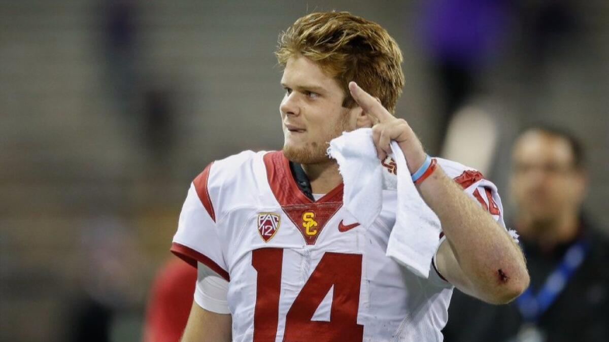 USC quarterback Sam Darnold waves to the crowd as he heads off the field after defeating Washington, 24-13, on Nov. 12.