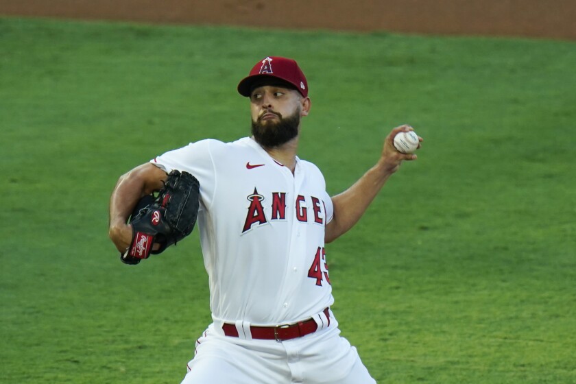 Los Angeles Angels starting pitcher winds up for a pitch.