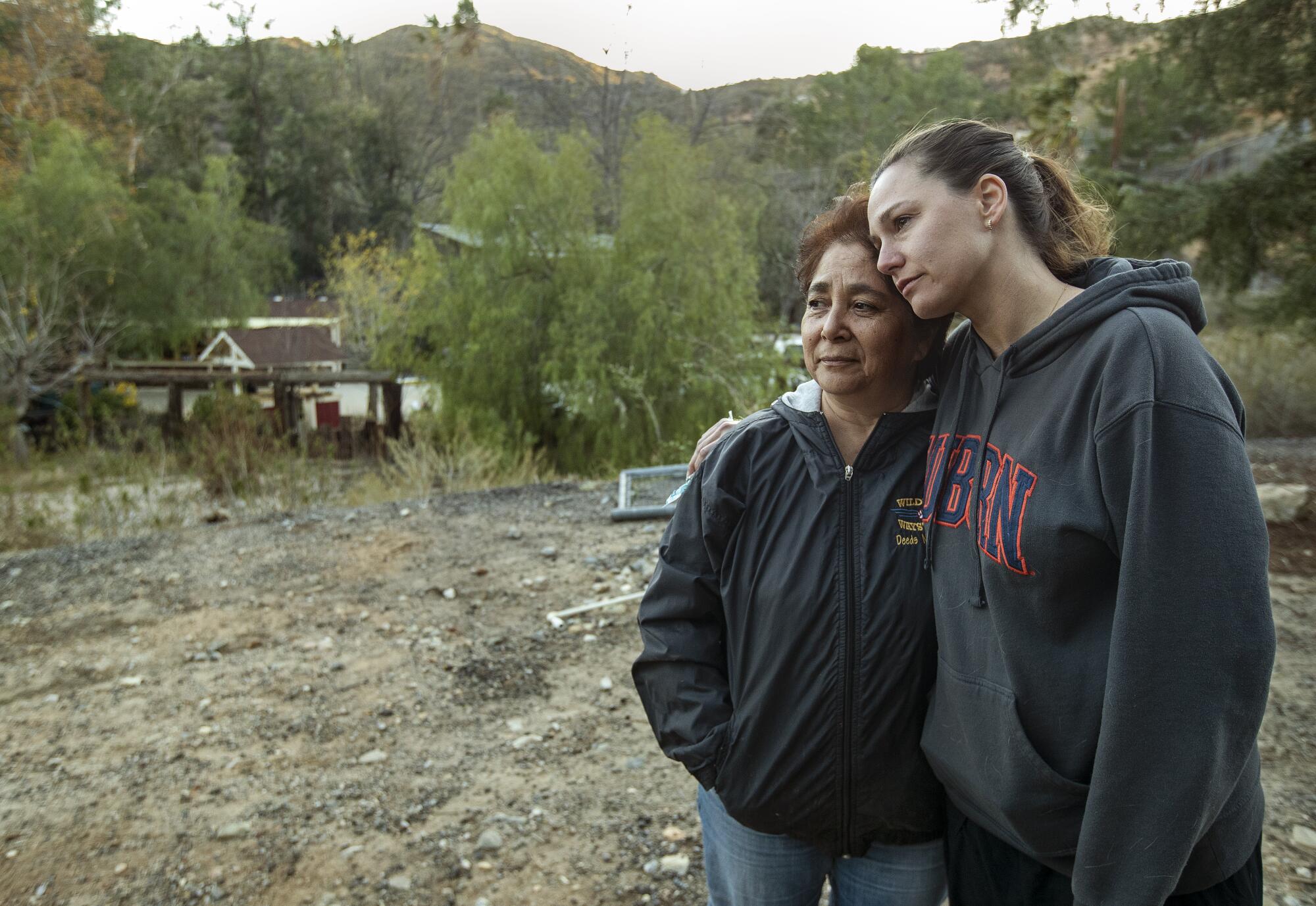 Two women side-hugging in the Angeles National Forest