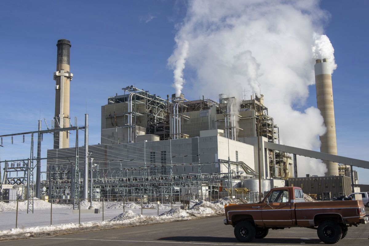 FILE - Carbon dioxide and other pollutants billows from stacks at the Naughton Power Plant, near where Bill Gates company, TerraPower plans to build an advanced, nontraditional nuclear reactor, on Jan. 12, 2022, in Kemmerer, Wyo. A major economic bill headed to the president has “game-changing” incentives for the nuclear energy industry, experts say, and those tax credits are even more substantial if a facility is sited in a community where a coal plant is closing. (AP Photo/Natalie Behring, File)