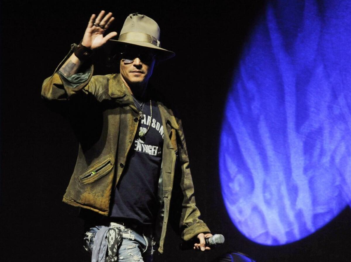 Johnny Depp arrives at CinemaCon to promote "The Lone Ranger."