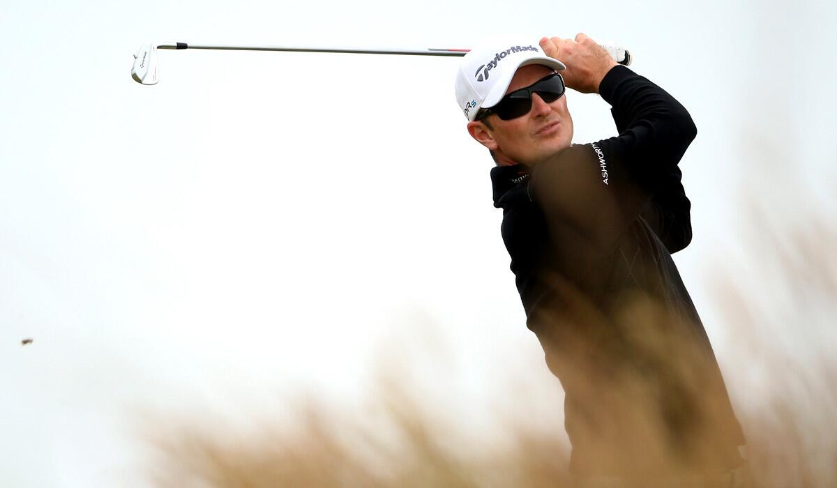 Justin Rose follows through on his tee shot at No. 18 during the third round of the Scottish Open on Saturday at Royal Aberdeen.