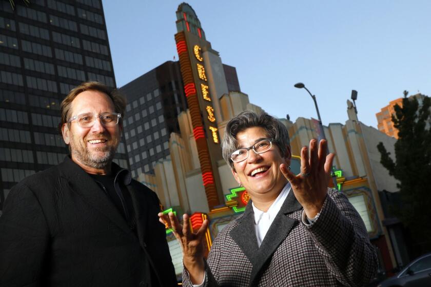 LOS ANGELES, CALIFORNIA--OCT.18, 2018--Brett Steele, let,t dean of the UCLA School of the Arts and Architecture and Kristy Edmunds, executive director and artistic director of the Center for the Art of Performance (CAP) at the newly acquired Crest Theater on Westwood Blvd., Los Angeles, CA, Oct. 18, 2018. (Carolyn Cole/Los Angeles Times)