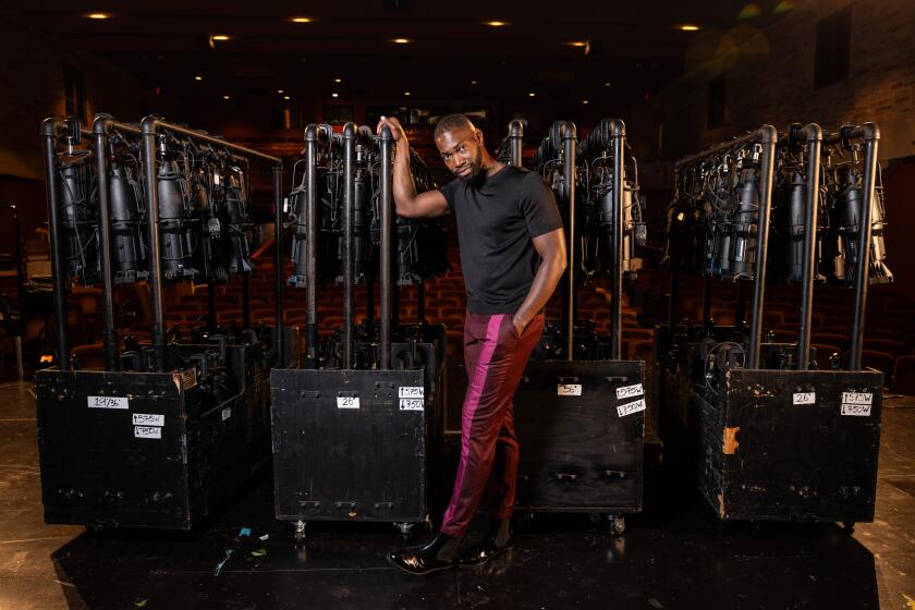 Los Angeles, CA - September 01: Playwright and Oscar-winning screenwriter Tarell Alvin McCraney is the new artistic director of Geffen Playhouse, and is photographed on the stage at the Los Angeles, CA, playhouse, Friday, Sept. 1, 2023. (Jay L. Clendenin / Los Angeles Times)