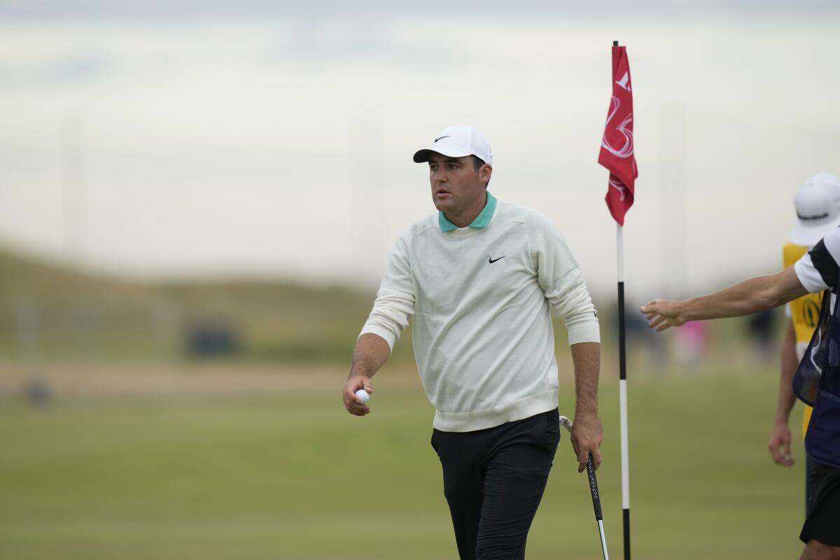Scottie Scheffler leaves the 14th green during the third round of the British Open on July 16, 2022.
