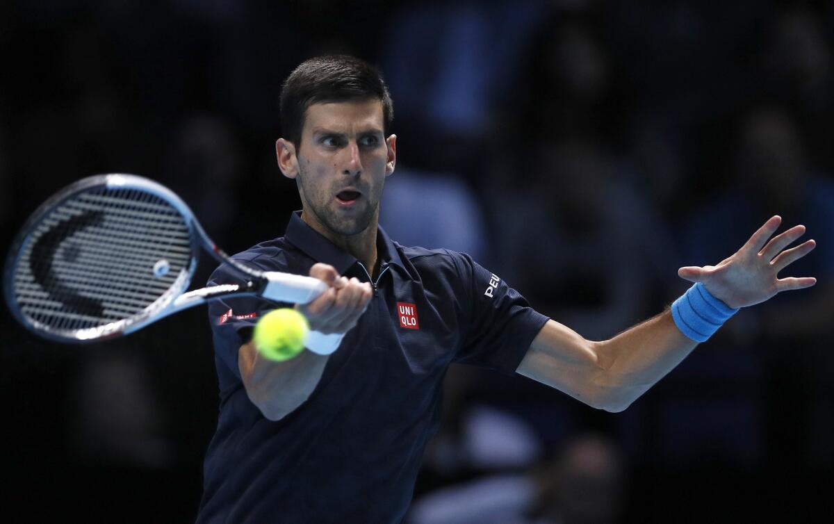Novak Djokovic returns a shot during his semifinal match against Kei Nishikori at ATP World Tour Finals on Saturday.