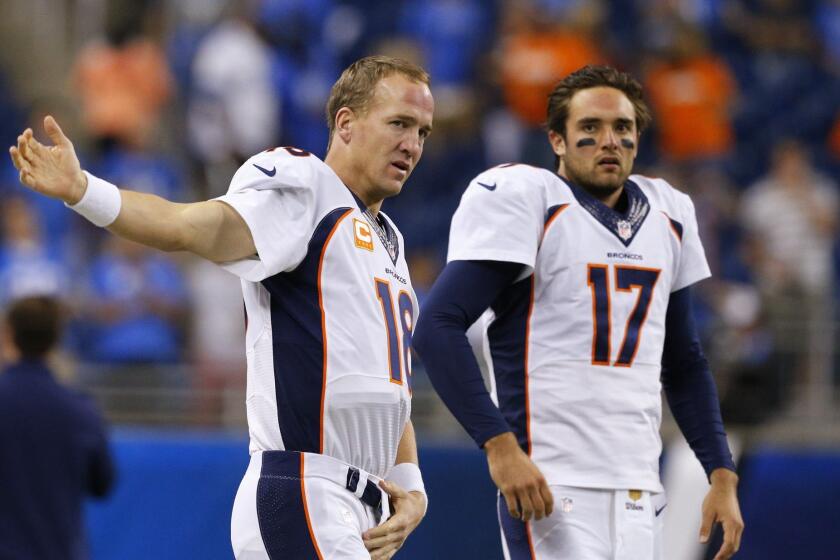 Denver quarterbacks Peyton Manning, left, and Brock Osweiler get ready for the Broncos' game against Detroit on Sept. 27.