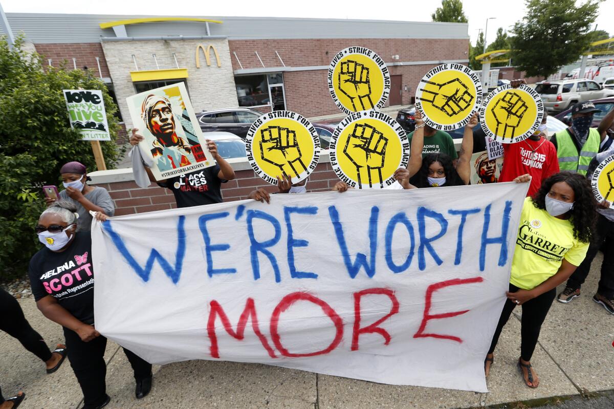 Protesters rally outside a McDonald's in Detroit