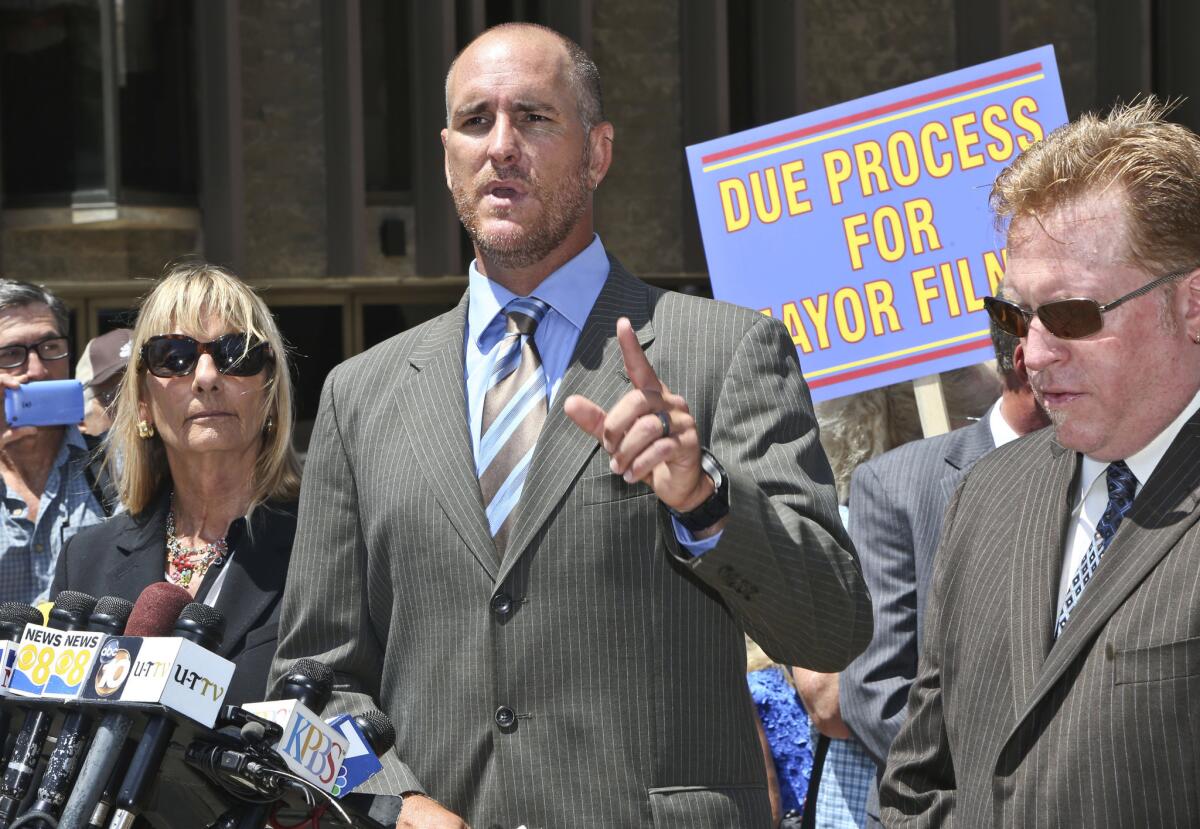 Attorney Marco Gonzalez, flanked by former San Diego Councilwoman Donna Frye, left, and attorney Corey Briggs, right, details sexual misconduct accusations against San Diego Mayor Bob Filner at a news conference.