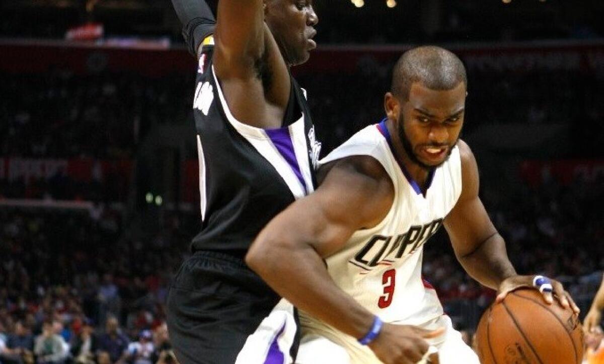 Clippers guard Chris Paul works against Sacramento guard Darren Collison during a game at Staples Center on Oct. 31.