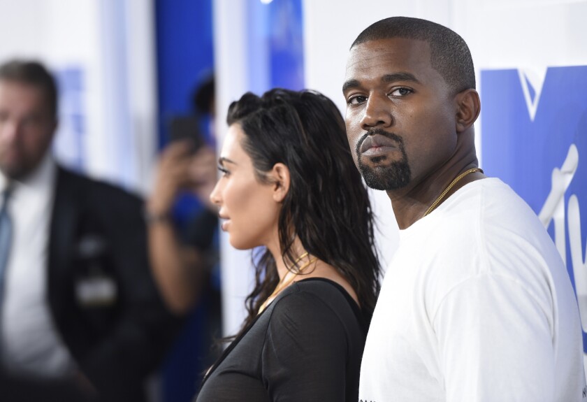 Kim Kardashian West, left, and Kanye West arrive at the MTV Video Music Awards in New York on Sunday, Aug. 28.