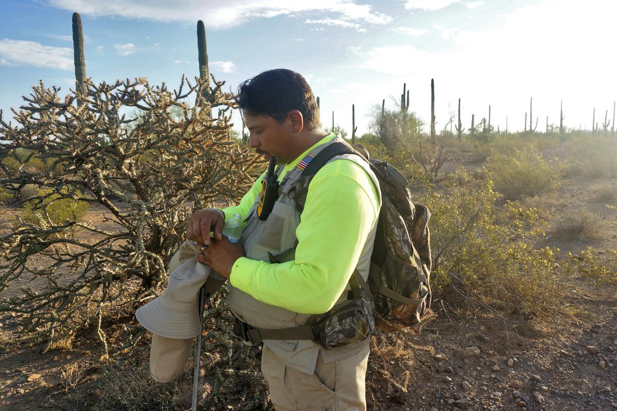 Óscar Andrade prays in the Ironwood Forest National Monument.