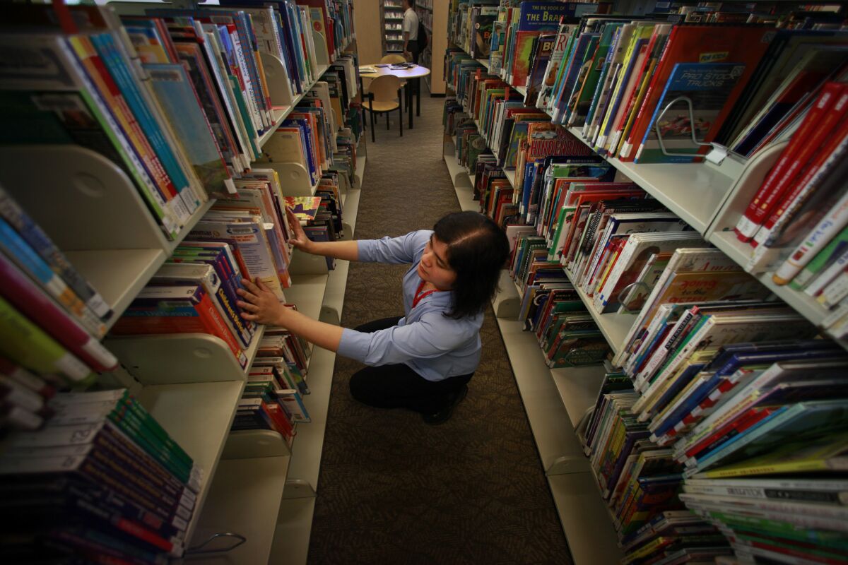 Organizing the bookshelves at the Los Angeles Public Library.