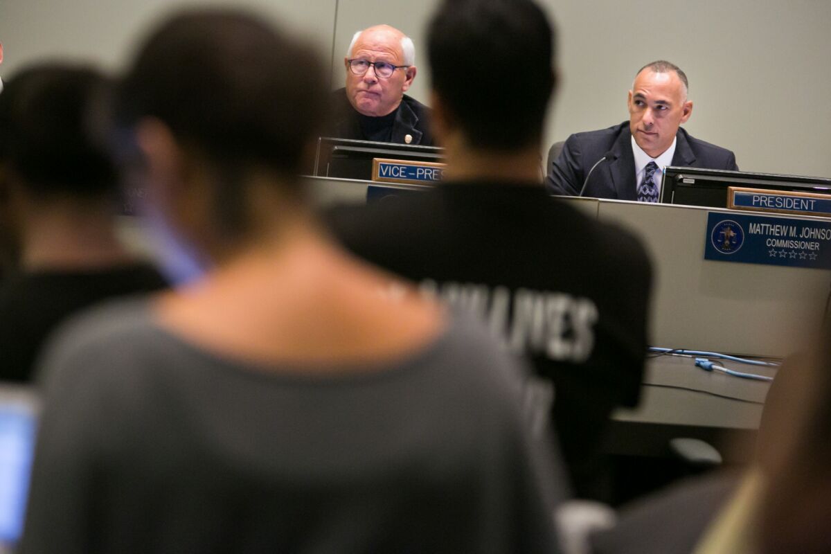 Police Commissioner Steve Soboroff, left, and Police Commission President Matthew Johnson at a commission meeting.