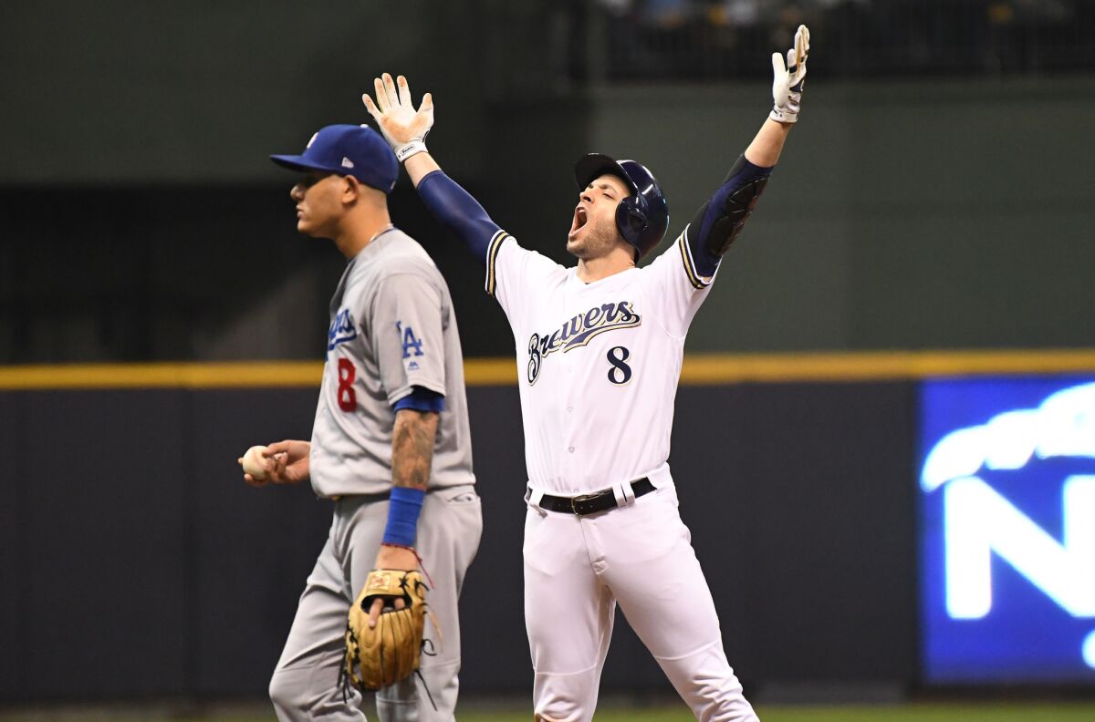 Brewers Ryan Braun celebrates after hitting a double which drove in a run in the second inning of game six of the National League Championship Series against the Milwaukee Brewers at Miller Park.