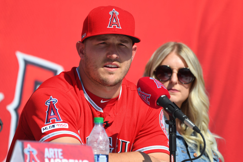 Mike Trout and wife Jessica take part in a news conference.