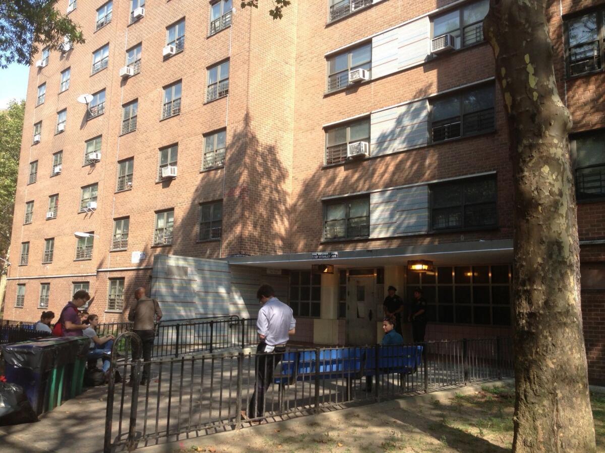 Reporters wait outside the Brooklyn, N.Y., apartment of Idella Carey, Miriam's mother.