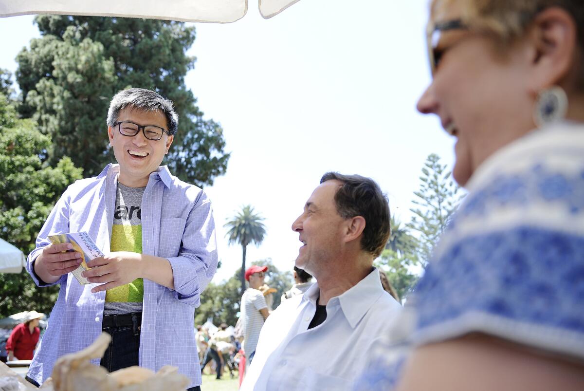State Treasurer John Chiang speaks with voters at the Summer Solstice Festival in Santa Barbara in June.