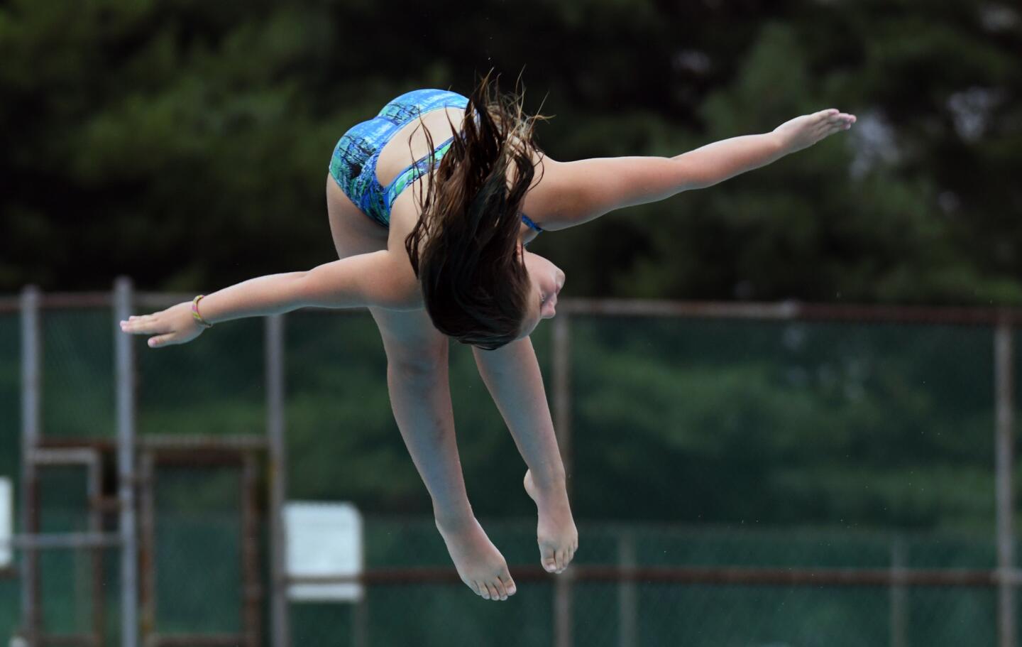 West Howard Swim Club diving team's Catherine Weish makes one of her dives during competition against North Saint Johns.