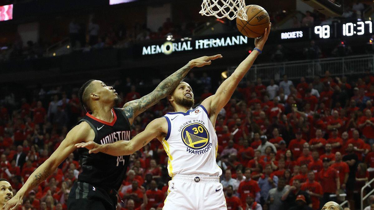 Golden State's Stephen Curry (30) goes up against Houston's Gerald Green (14) in the second half of Game Two of the Western Conference finals on Wednesday.