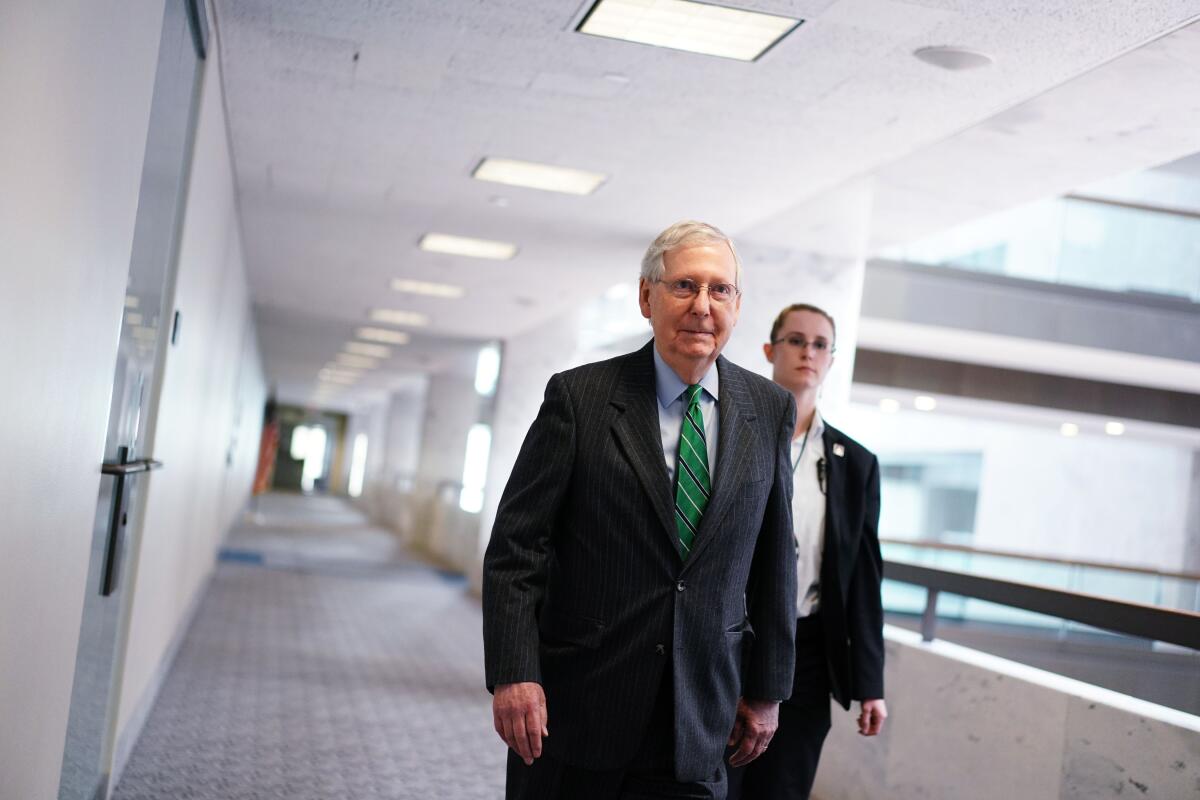 Majority Leader Mitch McConnell (R-Ky.) arrives for the Republican policy luncheon at the Hart Senate Office Building.