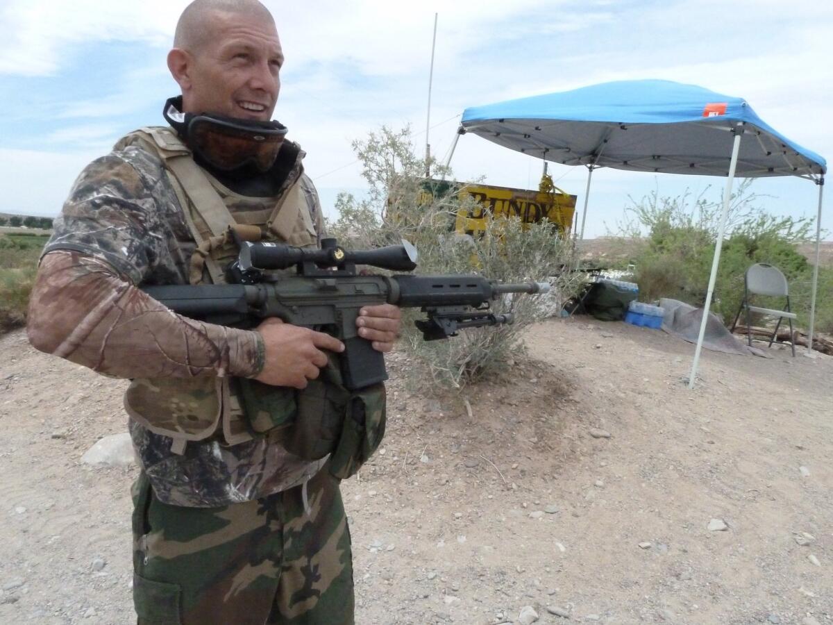 Militia member John Logan of Waco, Texas, stands at his sentry post outside the Cliven Bundy ranch in Nevada in April.