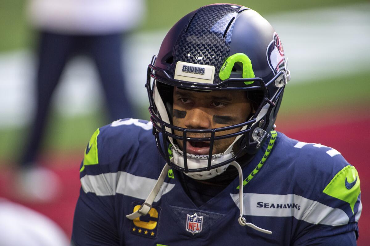 Seattle Seahawks quarterback Russell Wilson reacts on the field.