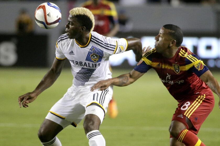 Galaxy forward Gyasi Zardes, left, controls the ball against Real Salt Lake's Joao Plata during the second half of a game May 27 at StubHub Center.